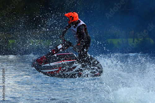  Freestyle Jet Skier performing 360  creating at lot of spray