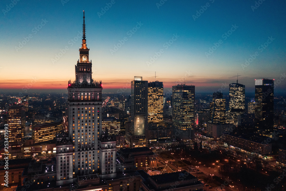 Aerial view of the business center of Warsaw: Palace of Science and Culture and skyscrapers in the evening