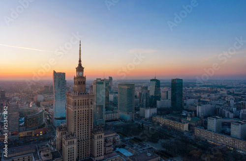 Aerial view of the business center of Warsaw: Palace of Science and Culture and skyscrapers in the evening © vladstar