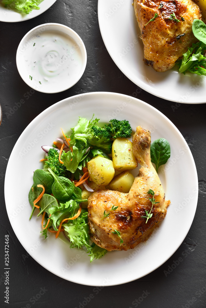 Grilled chicken leg with potato and green salad Grilled chicken leg with potato and green salad