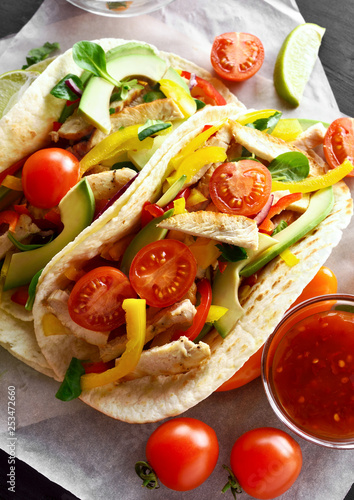 Tacos with chicken meat and vegetables