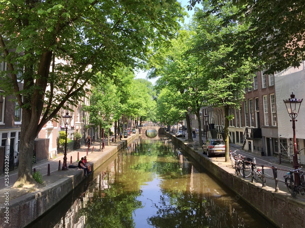 A summer sunny day on a pretty Amsterdam canal in the Netherlands