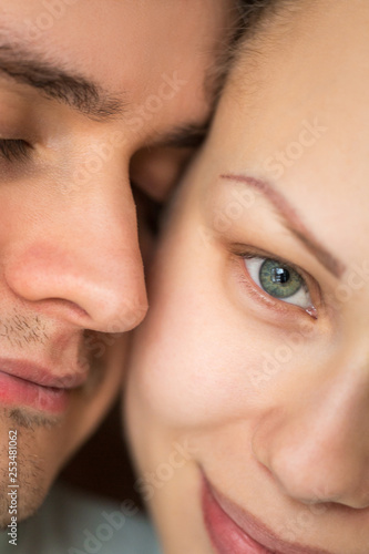 Close portrait of a young couple. Man and woman. Boy and girl in love.