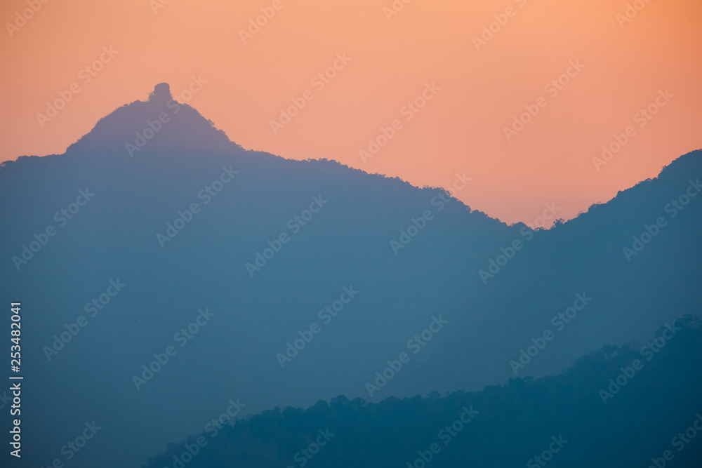 Obraz premium Sunset at mountain in Champasak town, Laos