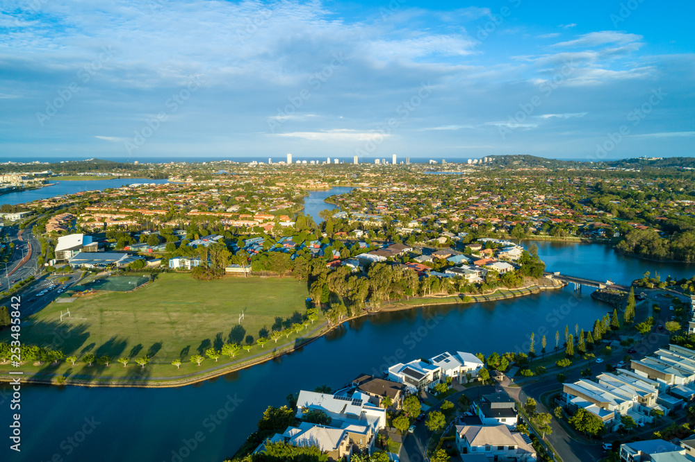 Aerial view of Varsity Lakes suburb and Reedy Creek at sunset. Gold Coast, Queensland, Australia