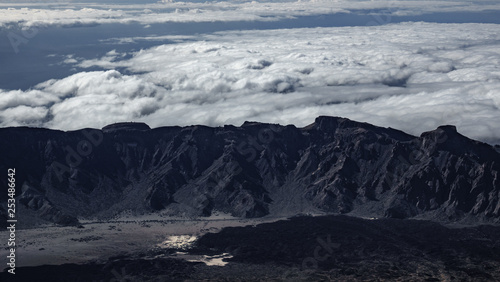 Aerial view of mountain range as a barrier for the clouds