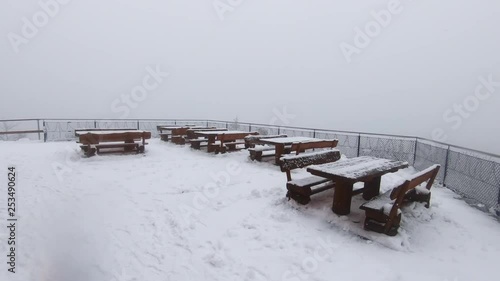 Shooting on the Swiss mountain during snowfall. photo