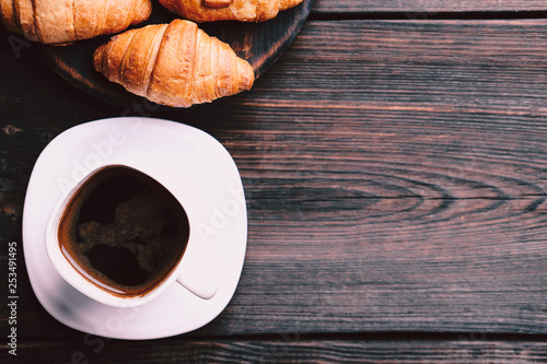 morning meals. cup of coffee and croissants, coffee break, sweets, food background. tasty continental breakfast, traditional french snack
