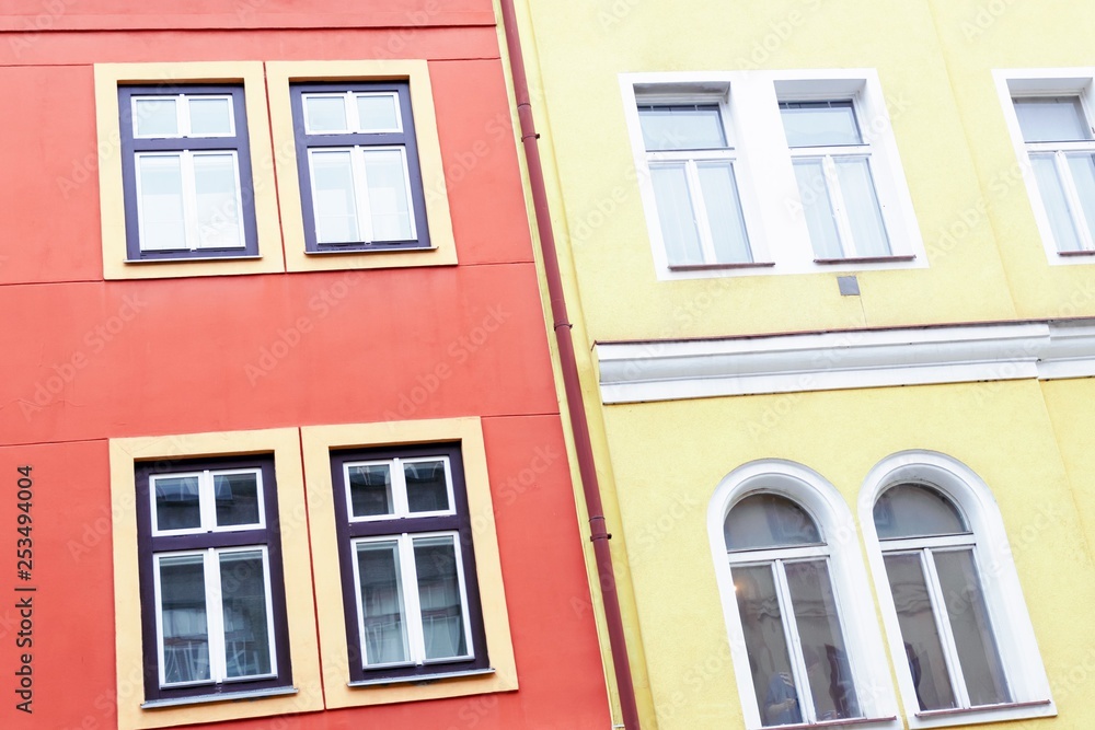 Coral color and yellow facade of houses. Fragment, details. Prague, Czech Republic