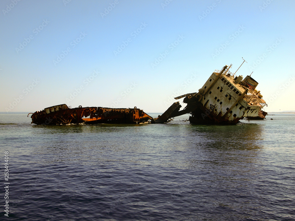 Shipwreck, wreckage of a cargo ship. The rusty wreck on Jackson reef, Tiran island, Red sea, Egypt.