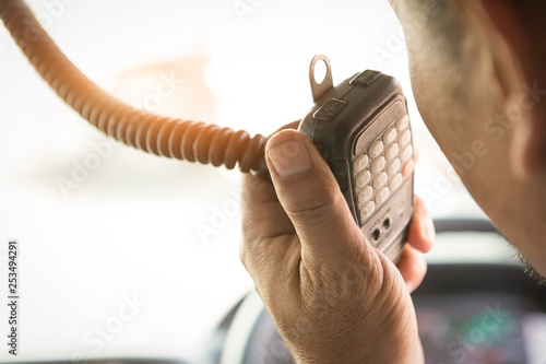 Truck Driver Making Talking Through Radio,Communication on the Highway,Concept transport on road,spot focus.