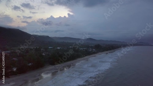 Wallpaper Mural An aerial view of a dramatic landscape of an island during sunrise. The camera is slowly moving backward and up revealing the whole island. The sky is covered with dramatic clouds. Torontodigital.ca