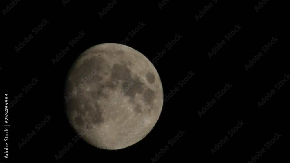 Large Moon against black sky, moving across the screen Large Moon against black sky, moving across the screen