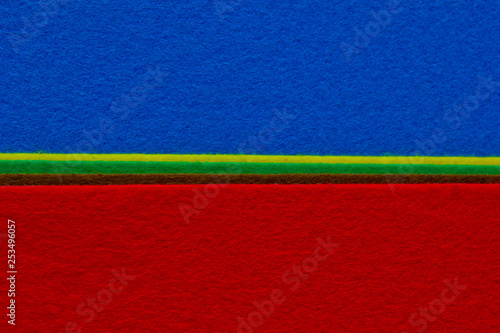 Pieces of coloured felt. Brown, red, turquoise, yellow and blue color composition. Colorful felt texture for background with copy space.