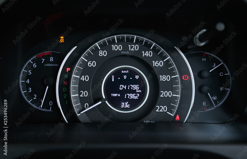 Close up of modern speedometer display in a car dashboard panel . Close up of modern speedometer display in a car dashboard panel .