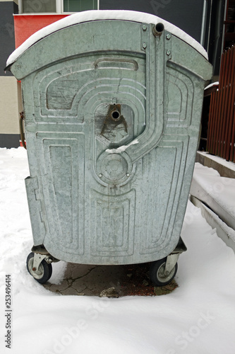 Snowy container for garbage photo