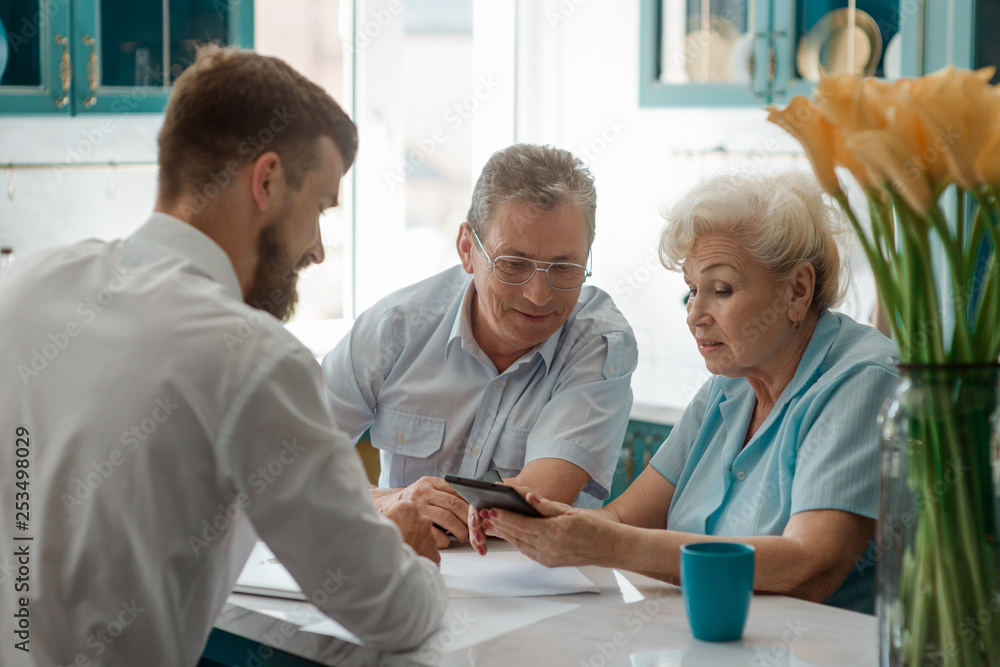 Fototapeta premium Elderly parents and their son