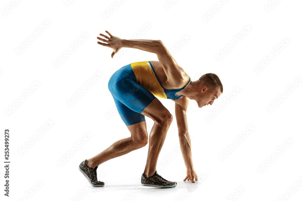 Young caucasian man running isolated on white studio background. One male runner or jogger. Silhouette of jogging athlete with shadows. Young caucasian man running isolated on white studio background. One male runner or jogger. Silhouette of jogging athlete with shadows.