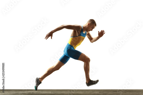 Young caucasian man running isolated on white studio background. One male runner or jogger. Silhouette of jogging athlete with shadows.