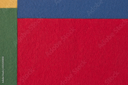 Pieces of coloured felt. Red, yellow, green and blue color composition. Colorful felt texture for background with copy space.