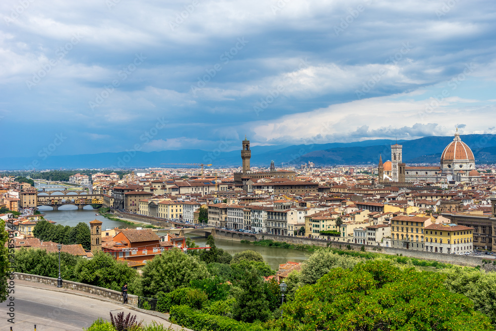 Panaromic view of Florence townscape cityscape viewed from Piazzale Michelangelo (Michelangelo Square) with ponte Vecchio and Palazzo Vecchio and Duomo
