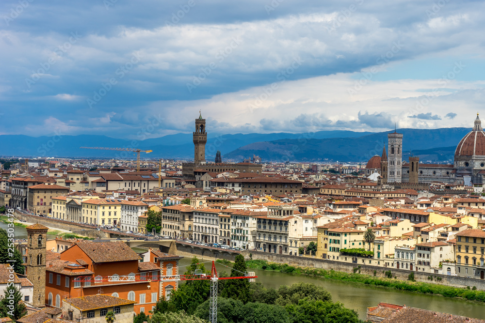 Panaromic view of Florence with Palazzo Vecchio and Duomo viewed from Piazzale Michelangelo (Michelangelo Square) with lamp post