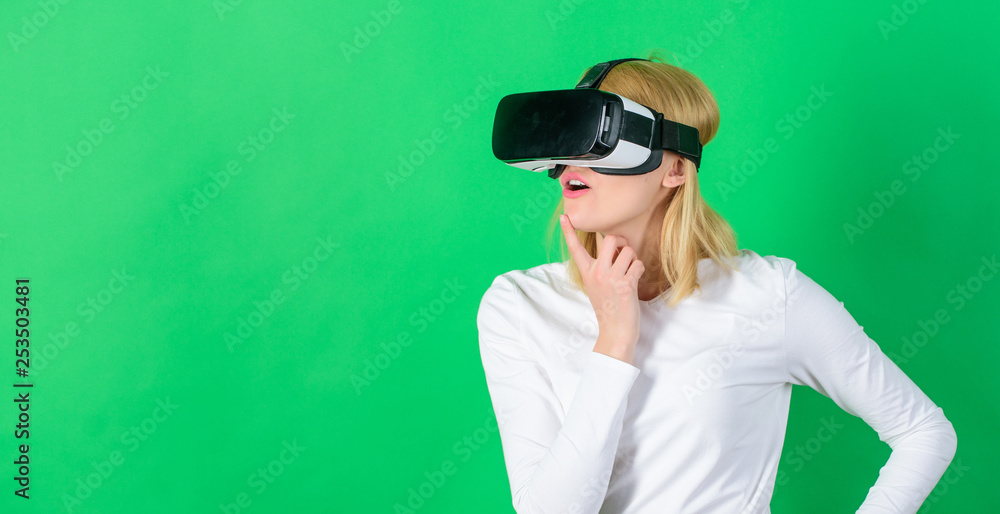 The woman with glasses of virtual reality. Woman using VR device. Cheerful smiling woman looking in VR glasses. Futuristic gadgets. The woman with glasses of virtual reality. Woman using VR device. Cheerful smiling woman looking in VR glasses. Futuristic gadgets.