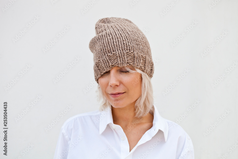 Pretty young woman in warm brown beanie Pretty young woman in warm brown beanie