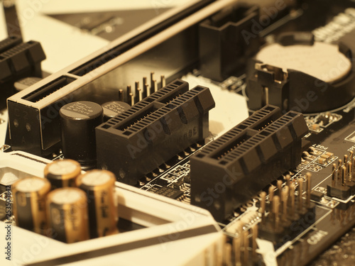 capacitors, resistors and other electronic components mounted on motherboard
