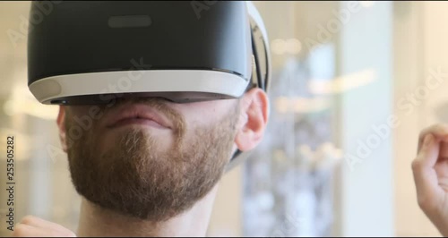 Man using virtual reality headset indoors 4k, close-up