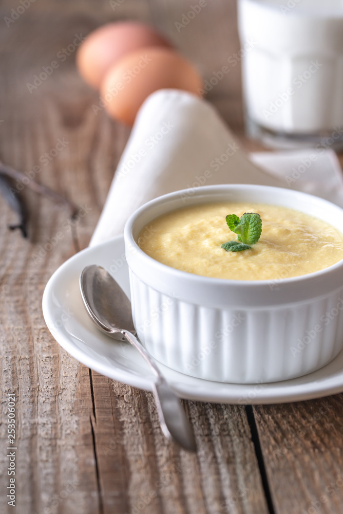 Custard on the wooden background Custard on the wooden background