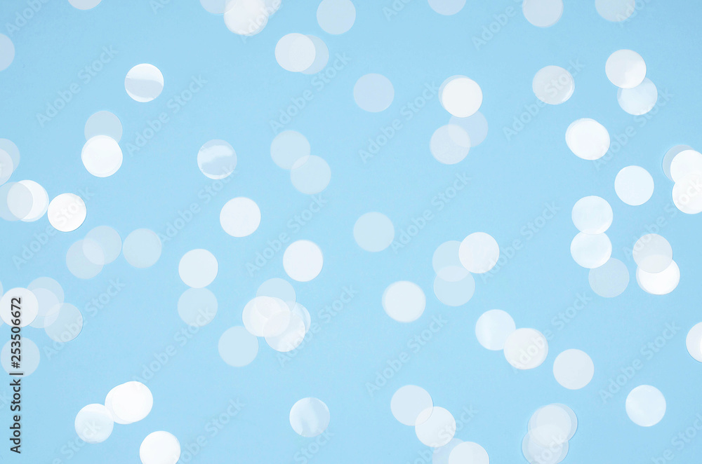 Blue background with white round confetti. Blue background with white round confetti.