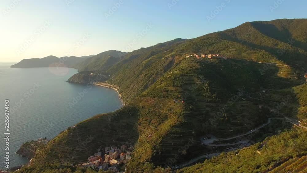 Beautiful view of the Cinque Terre mountains in Italy at sunset, revealing terraces in the foreground Beautiful view of the Cinque Terre mountains in Italy at sunset, revealing terraces in the foreground