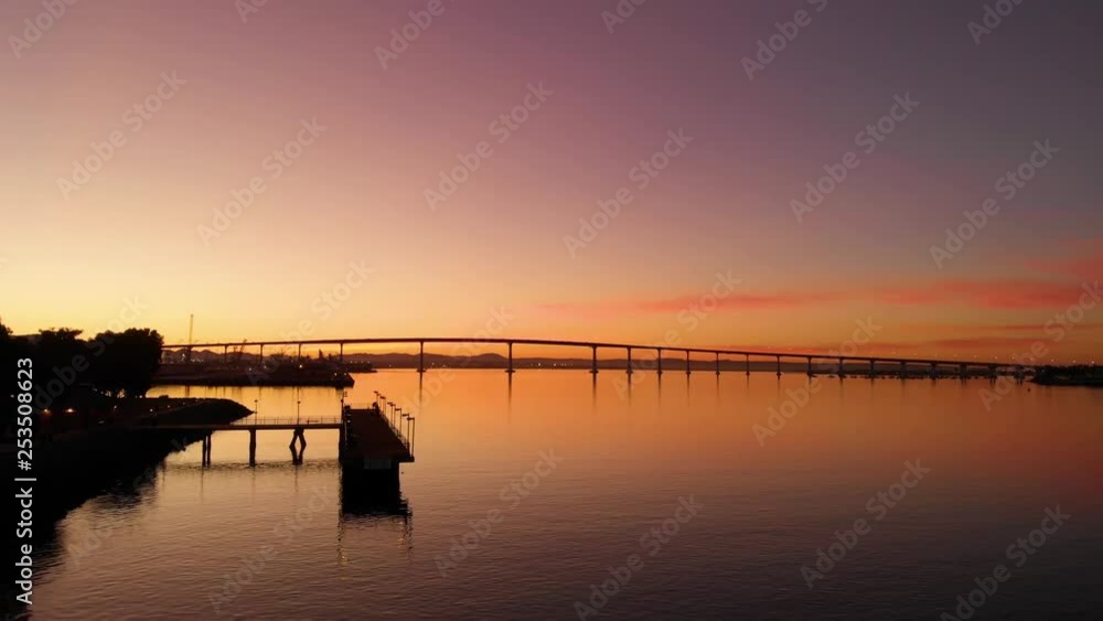 San Diego Coronado Bridge Skyline Overlook from Pier at Sunrise Aerial San Diego Coronado Bridge Skyline Overlook from Pier at Sunrise Aerial