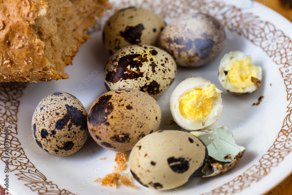 Boiled quail eggs on plate.