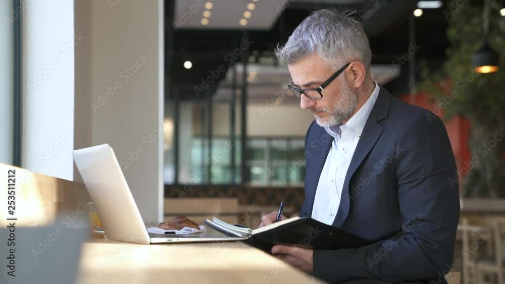Businessman preparing meeting in modern office space Businessman preparing meeting in modern office space