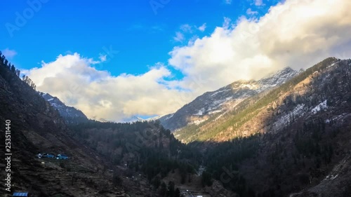 A beautiful winter timelapse of mountains and clouds of tosh,india. photo