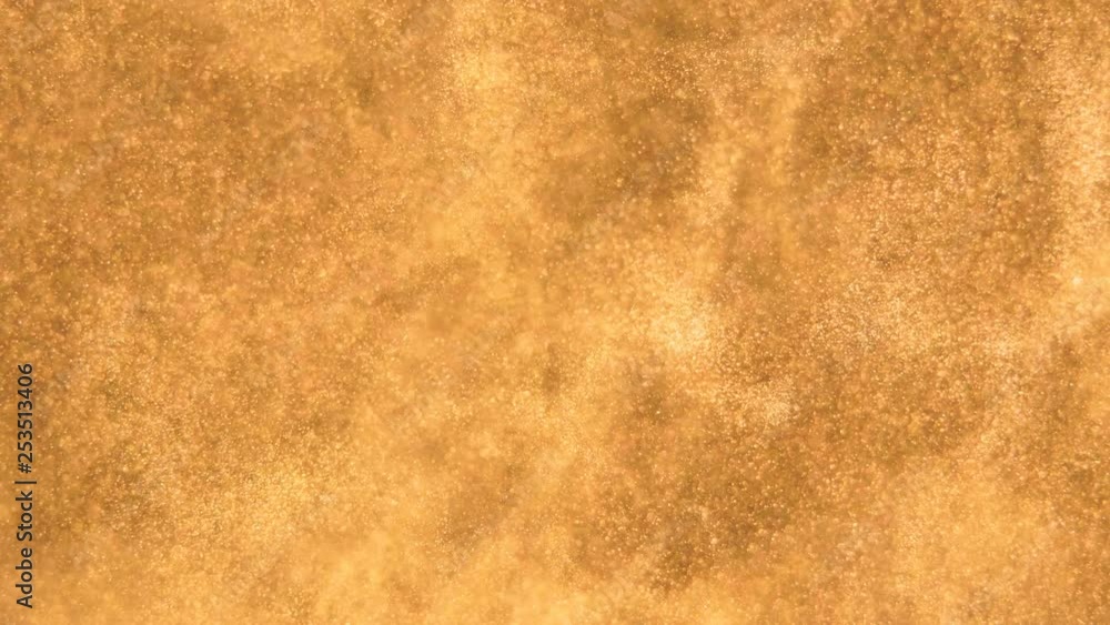 Elegant, detailed, and golden particles flow with shallow depth of field underwater