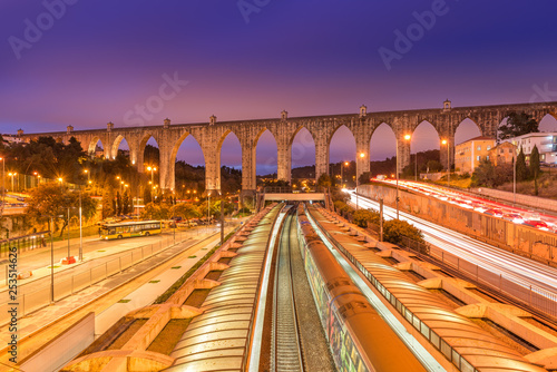 View of The Aguas Livres Aqueduct and Campolide train station, Lisbon, Portugal photo