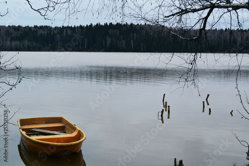 Wooden boat on the pond