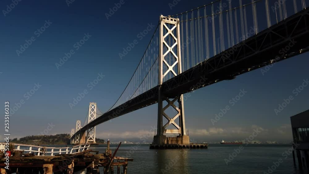 View under the Bay Bridge looking toward Treasure Island, deteriorating pier in foreground View under the Bay Bridge looking toward Treasure Island, deteriorating pier in foreground