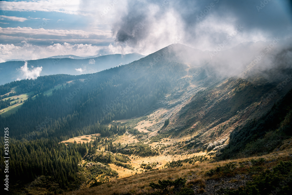 Mountain valley during sunrise. Natural summer landscape