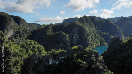 Aerial Descending View Over Mountainous Tropical Islands, Kayangan Lake. photo