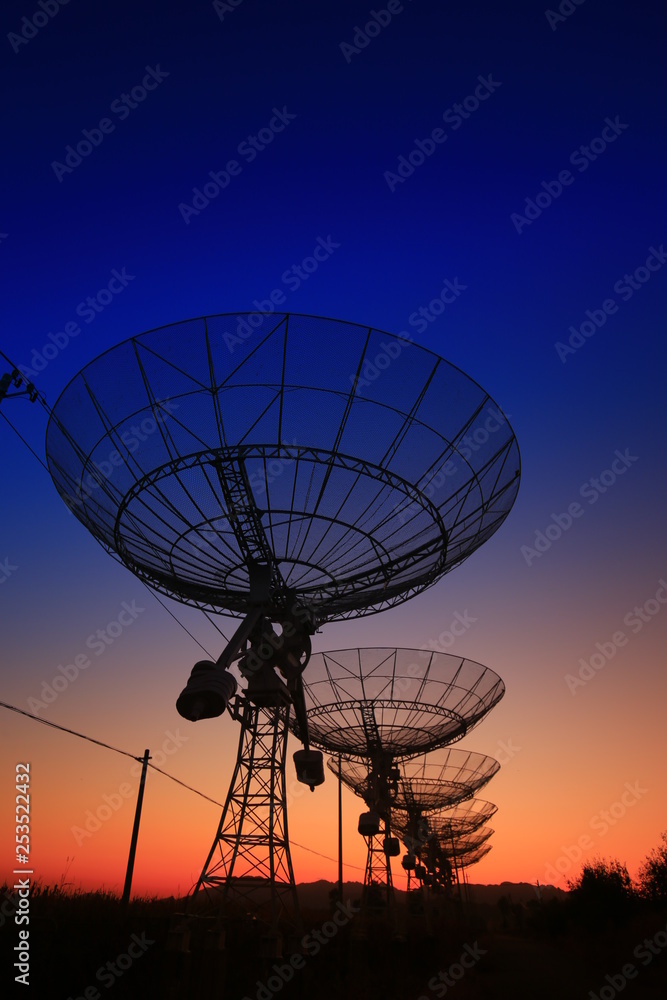 The silhouette of a radio telescope observatory The silhouette of a radio telescope observatory