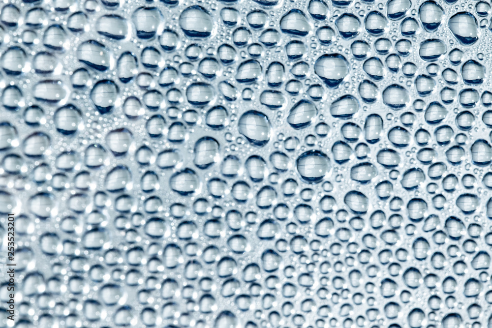 drops of water on a glass close-up background drops of water on a glass close-up background