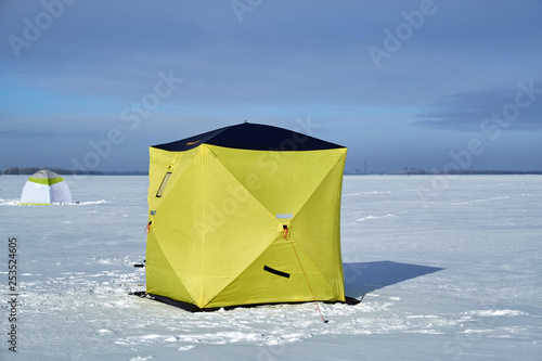 tent for winter fishing on the river