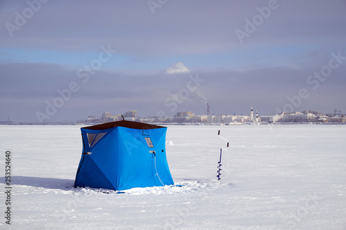 tent for winter fishing on the river