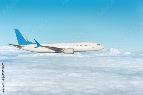 Airplane flying above the clouds, side view
