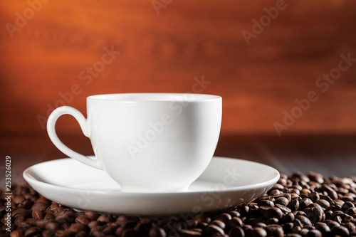 A cup of hot aromatic coffee on the table.