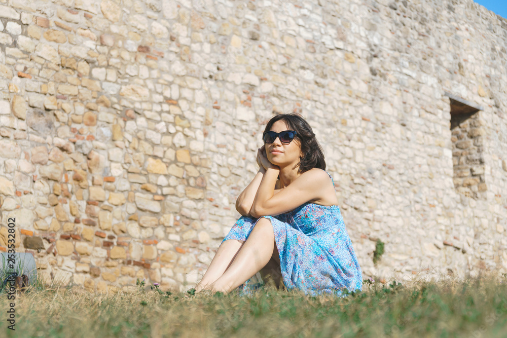 woman in sunglasses on grass woman in sunglasses on grass